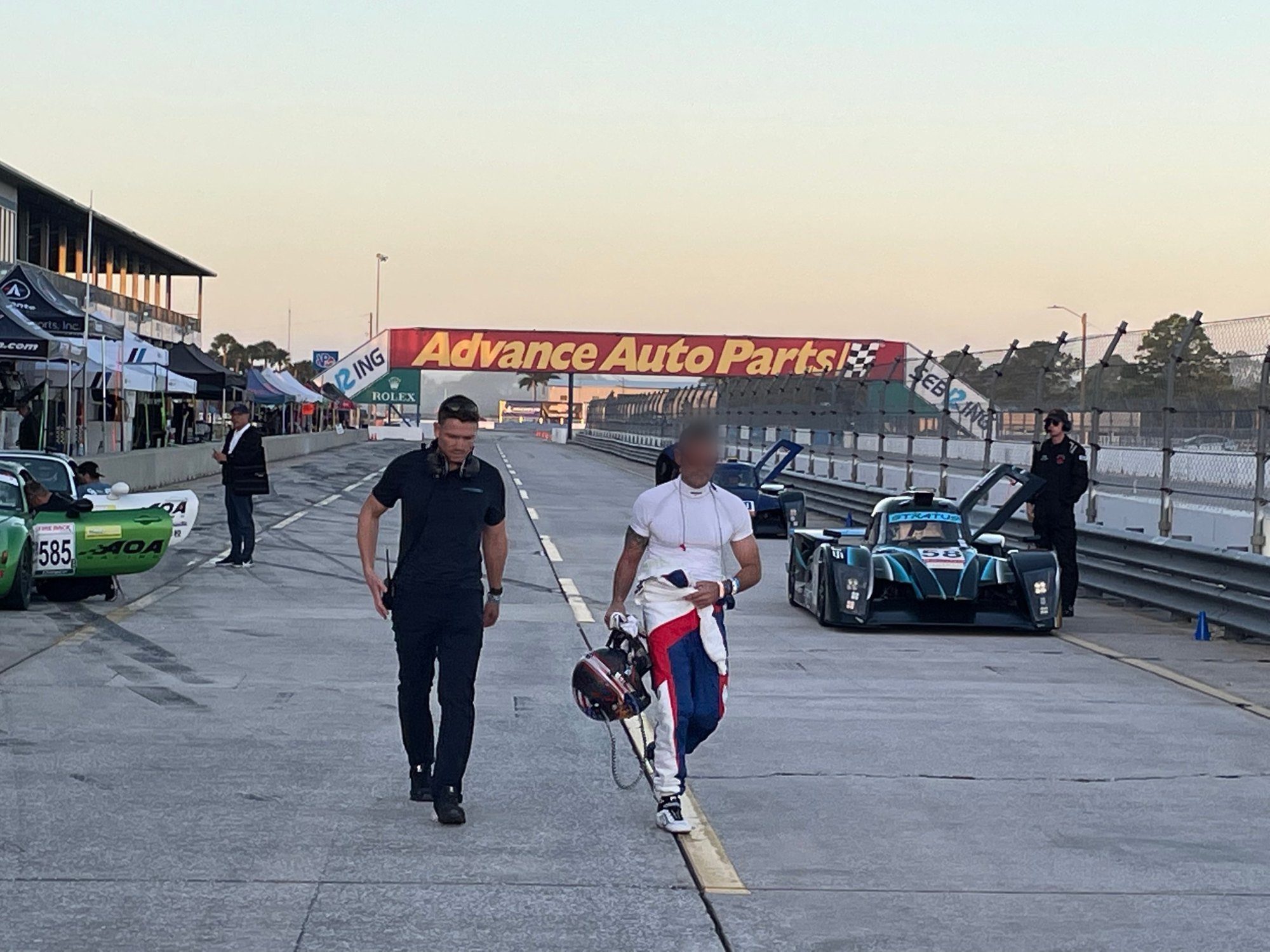 Alex Waters walking the Sebring pit lane with a client driver