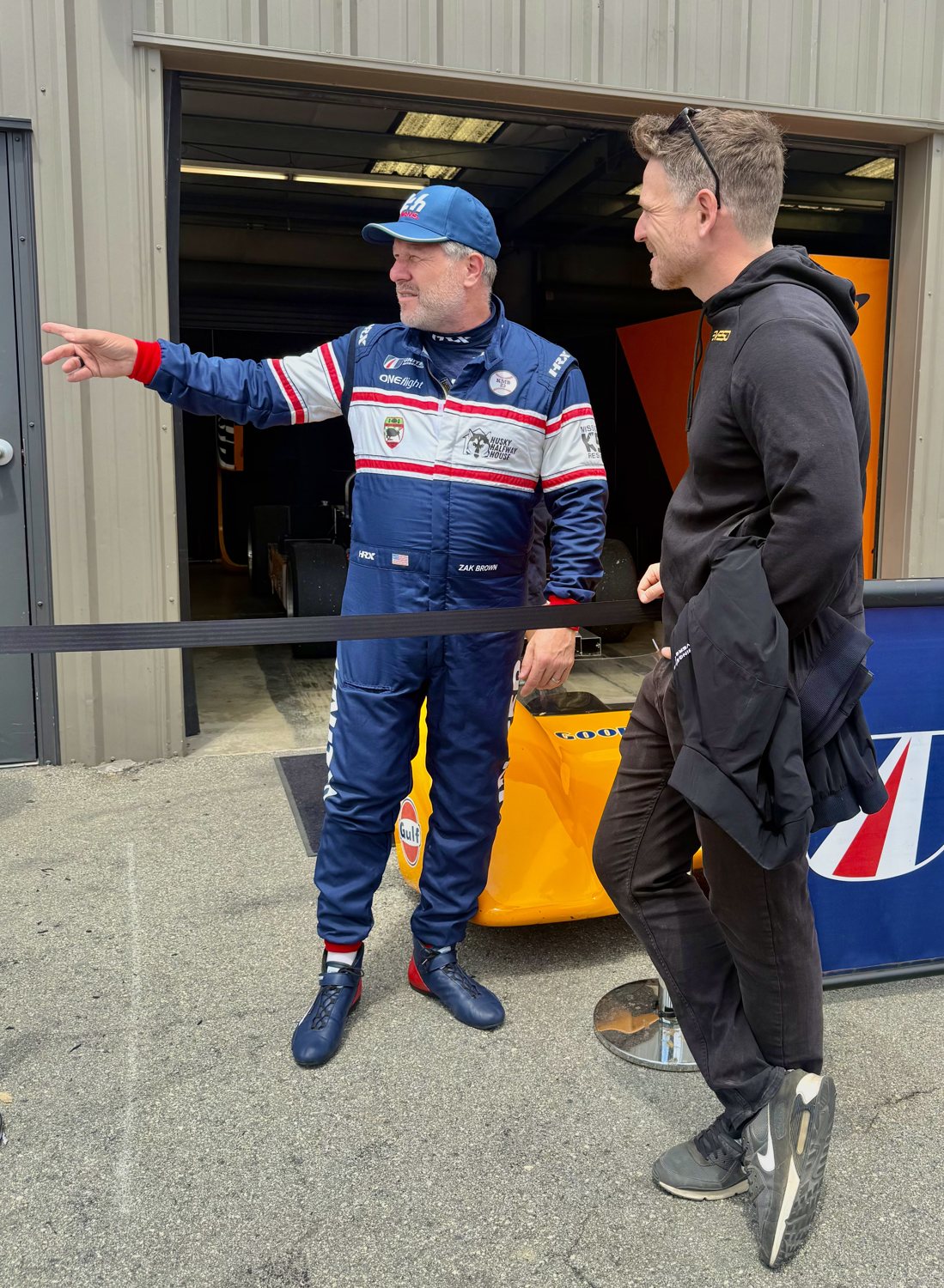 Alex Waters with Zak Brown at the Rolex Monterey Motorsports Reunion